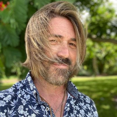 Kyan is wearing a Hawaiian shirt.